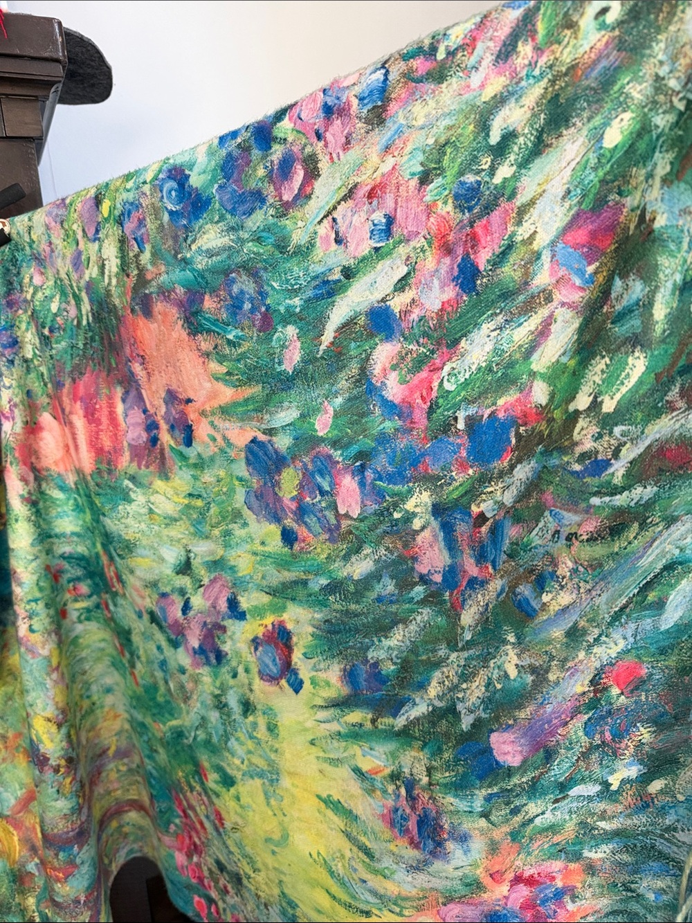 This is a vibrant Monet-inspired floral art shawl featuring a